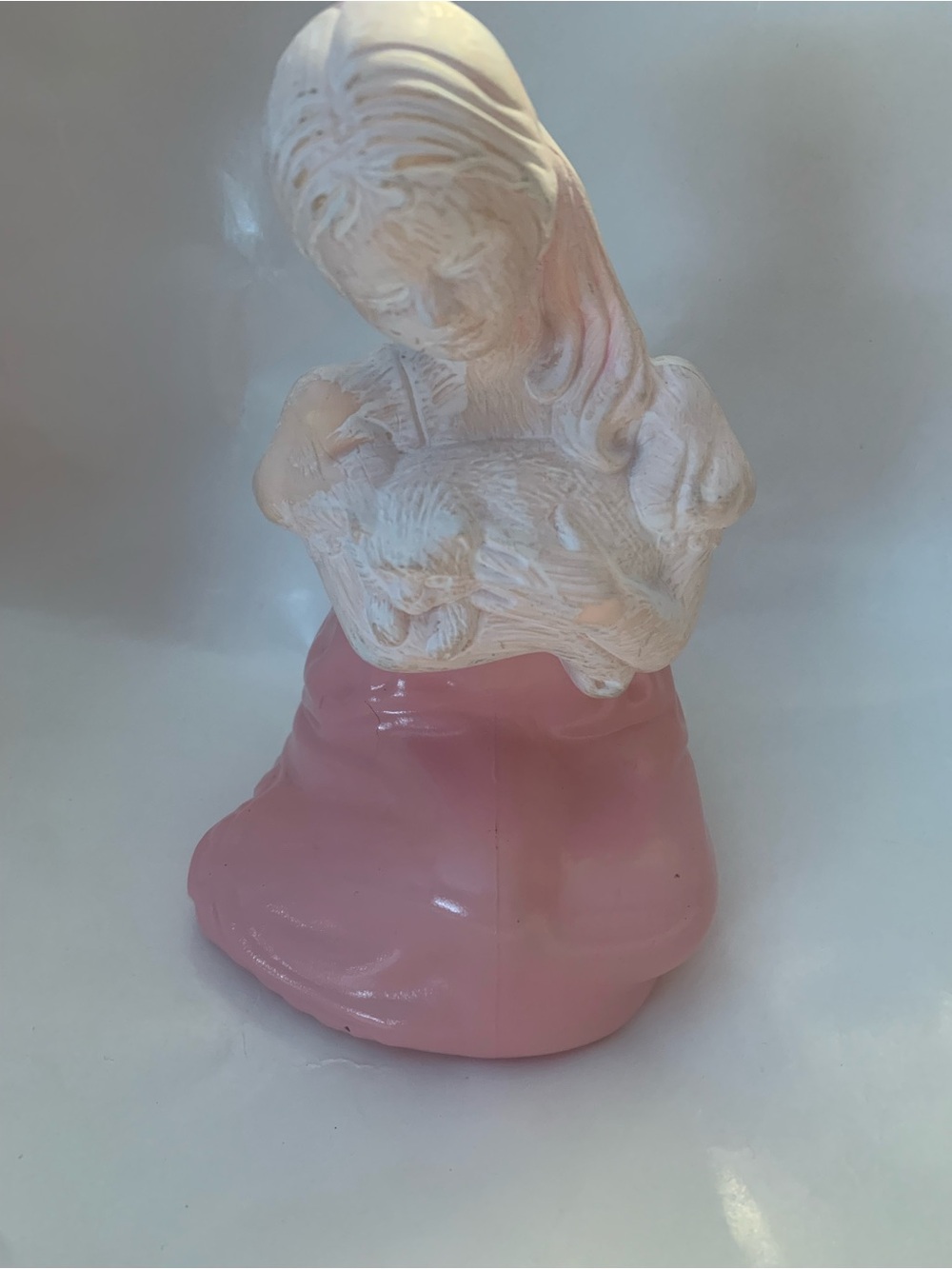 a vintage Avon "Dear Friends" collectible decanter featuring a girl in a pink dr
